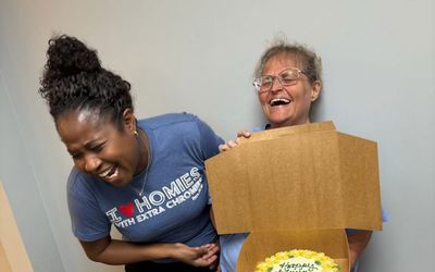 Two Therapy Connections team members laughing together